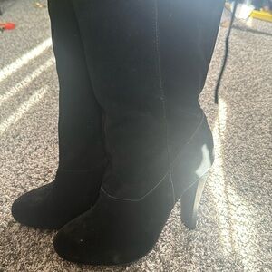Knee high heeled black boots